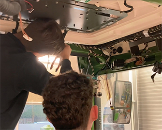 Photo of the team retrofitting the Fendt Connect system