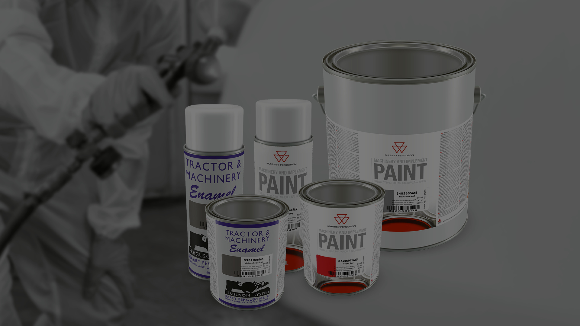 A picture of various Massey Ferguson paint products with a paint sprayer in the background